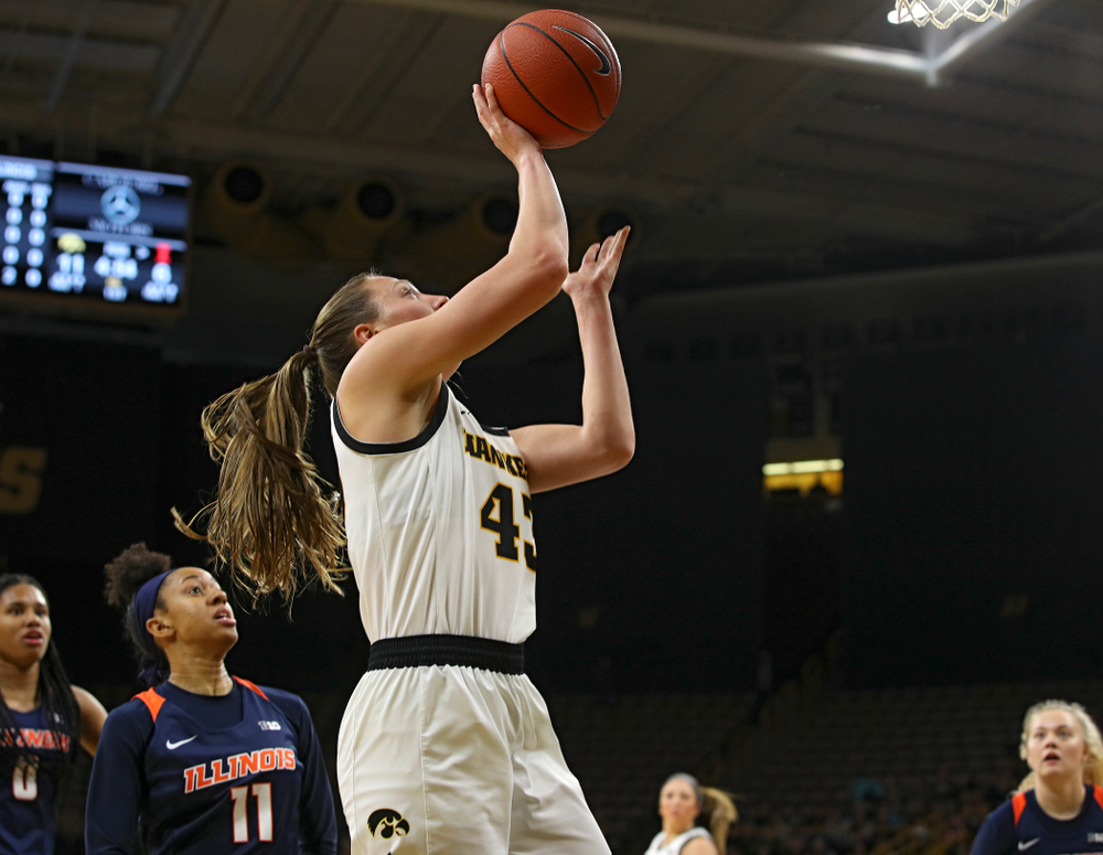 Iowa Hawkeyes forward Amanda Ollinger (43) scores a basket inside during the first quarter of their game at Carver-Hawkeye Arena in Iowa City on Tuesday, December 31, 2019. (Stephen Mally/hawkeyesports.com)