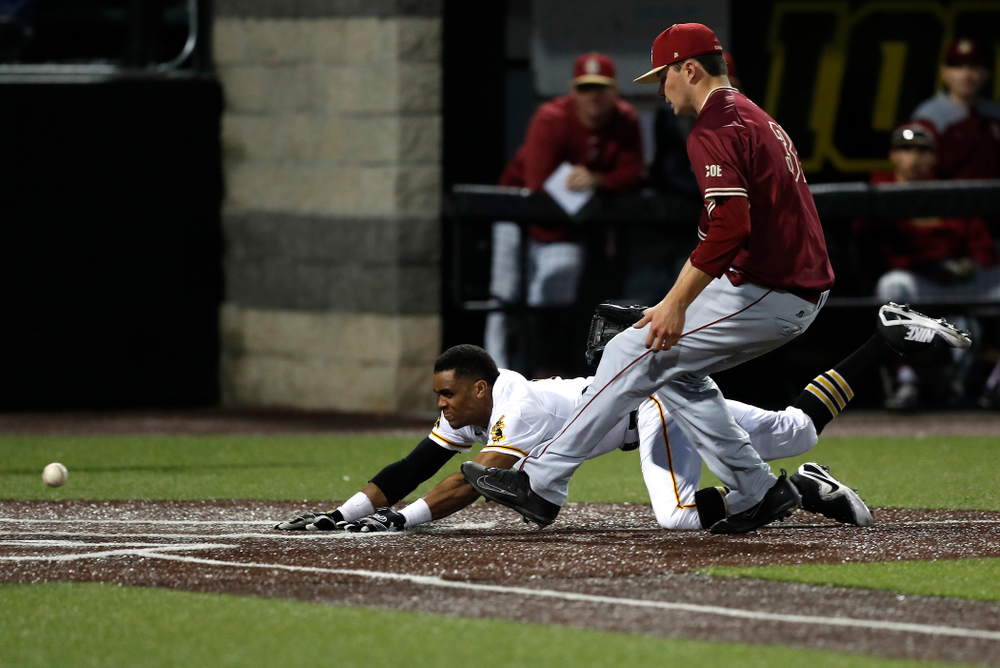Iowa Hawkeyes third baseman Lorenzo Elion (1) scores against Coe College Wednesday, April 11, 2018 at Duane Banks Field. (Brian Ray/hawkeyesports.com)