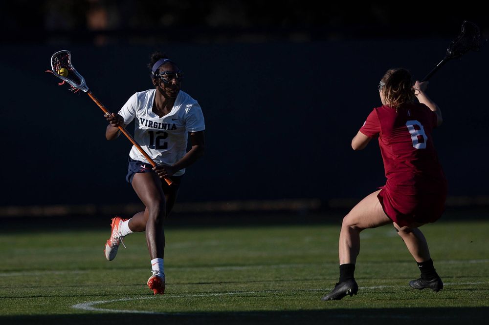 STANFORD, California - FEBRUARY 14: Virginia Cavaliers defense Jalen Knight (12) runs up field past Stanford Cardinal defense Kyra Pelton (8) during the second half at Cagan Stadium on February 14, 2020 in Stanford, California. The Virginia Cavaliers defeated the Stanford Cardinal 12-11. (Photo by Jason O. Watson)