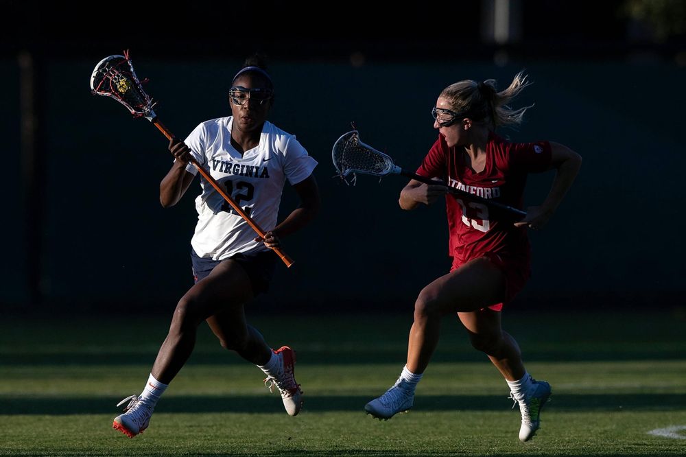 STANFORD, California - FEBRUARY 14: Virginia Cavaliers defense Jalen Knight (12) runs past Stanford Cardinal attack Ali Baiocco (13) during the second half at Cagan Stadium on February 14, 2020 in Stanford, California. The Virginia Cavaliers defeated the Stanford Cardinal 12-11. (Photo by Jason O. Watson)