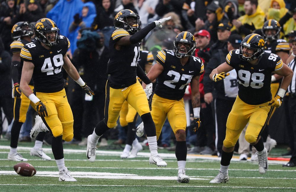 Iowa Hawkeyes defensive back Michael Ojemudia (11) celebrates after making an interception during a game against Nebraska at Kinnick Stadium on November 23, 2018. (Tork Mason/hawkeyesports.com)