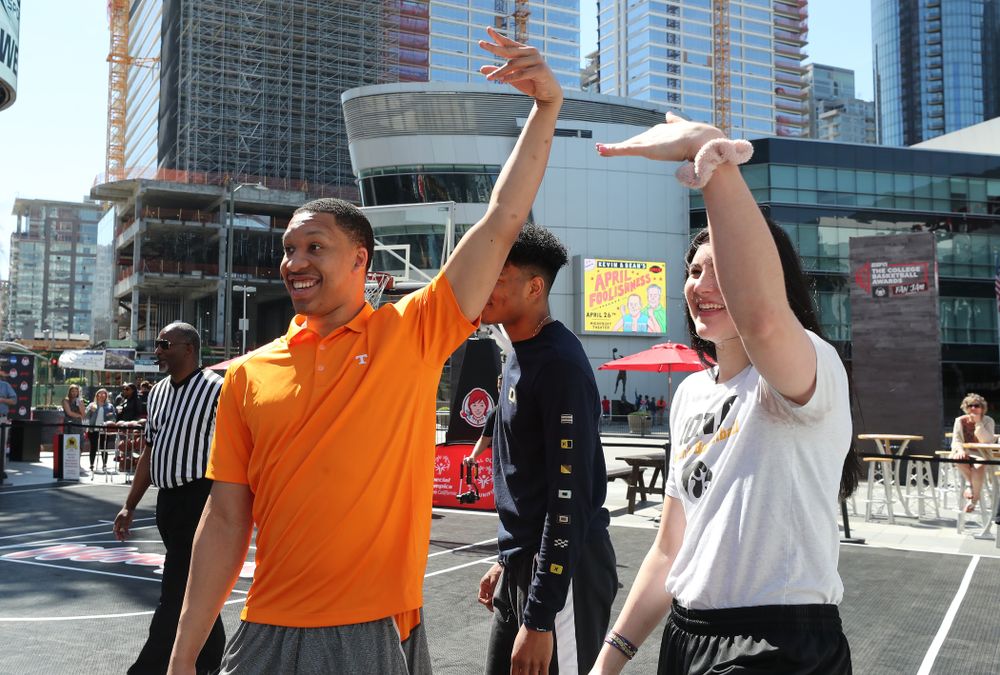 Iowa Hawkeyes forward Megan Gustafson (10) and TennesseeÕs Grant Williams during a Special Olympics event Friday, April 12, 2019 as part of the ESPN College Basketball Awards in the XBOX Plaza at LA Live. (Brian Ray/hawkeyesports.com)