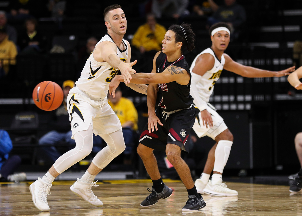 Iowa Hawkeyes guard Connor McCaffery (30) defends during a game against Guilford College at Carver-Hawkeye Arena on November 4, 2018. (Tork Mason/hawkeyesports.com)