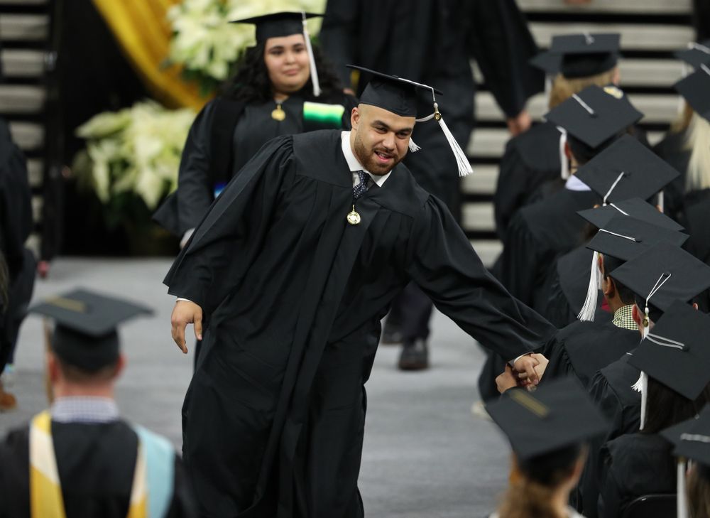 Iowa Football's Austin Kelly during the Fall Commencement Ceremony Saturday, December 15, 2018 at Carver-Hawkeye Arena. (Brian Ray/hawkeyesports.com)