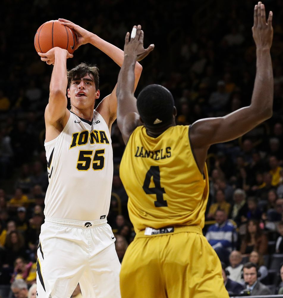 Iowa Hawkeyes forward Luka Garza (55) shoots a 3-pointer during a game against Alabama State at Carver-Hawkeye Arena on November 21, 2018. (Tork Mason/hawkeyesports.com)