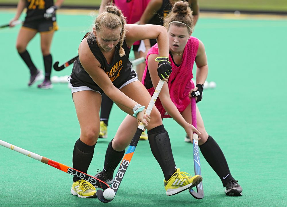 Iowa’s Katie Birch (11) and Meghan Conroy (5) run a drill during practice at Grant Field in Iowa City on Thursday, Aug 15, 2019. (Stephen Mally/hawkeyesports.com)