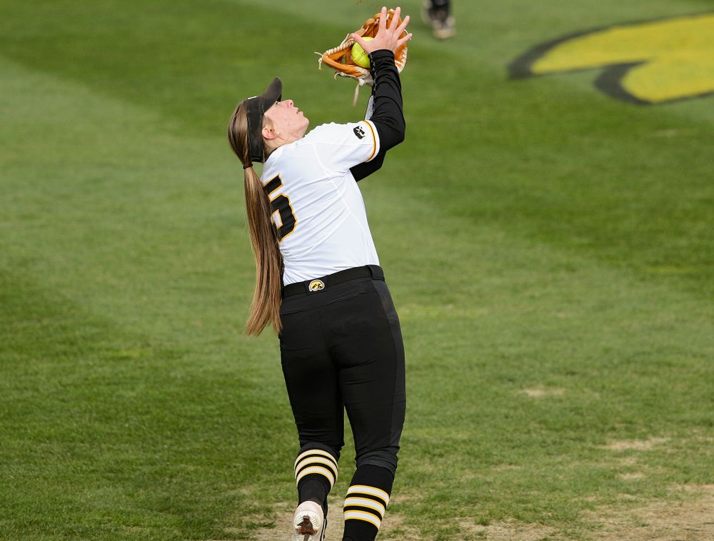 Iowa shortstop Sydney Owens (5) pulls in a pop up for an out during the third inning of their game against Illinois at Pearl Field in Iowa City on Friday, Apr. 12, 2019. (Stephen Mally/hawkeyesports.com)