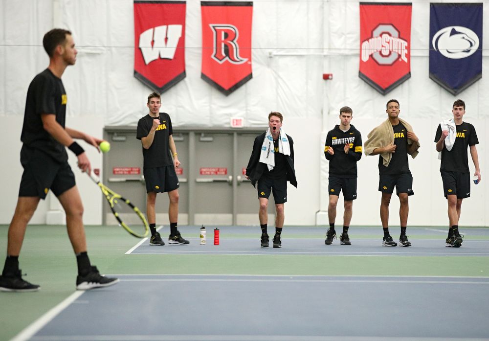 Iowa’s Nikita Snezhko, Jason Kerst, Morgan Lohan, Oliver Okonkwo, and Matt Clegg celebrate after Kareem Allaf (left) won his match against Marquette at the Hawkeye Tennis and Recreation Complex in Iowa City on Saturday, January 25, 2020. (Stephen Mally/hawkeyesports.com)