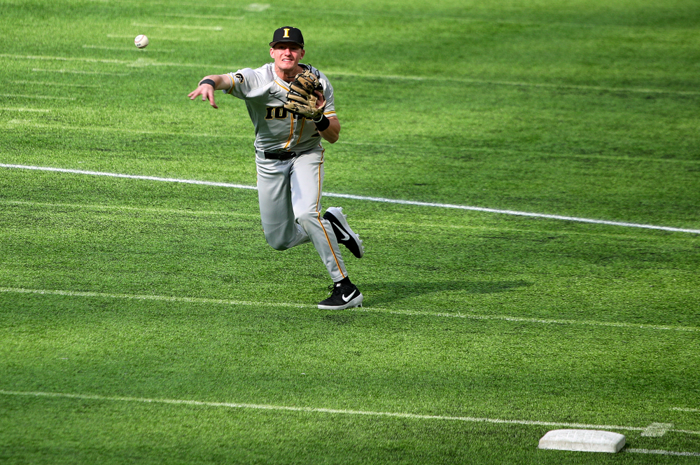 Iowa Hawkeyes infielder Brendan Sher (2) throws to first during the first inning of their CambriaCollegeClassic game at U.S. Bank Stadium in Minneapolis, Minn. on Friday, February 28, 2020. (Stephen Mally/hawkeyesports.com)