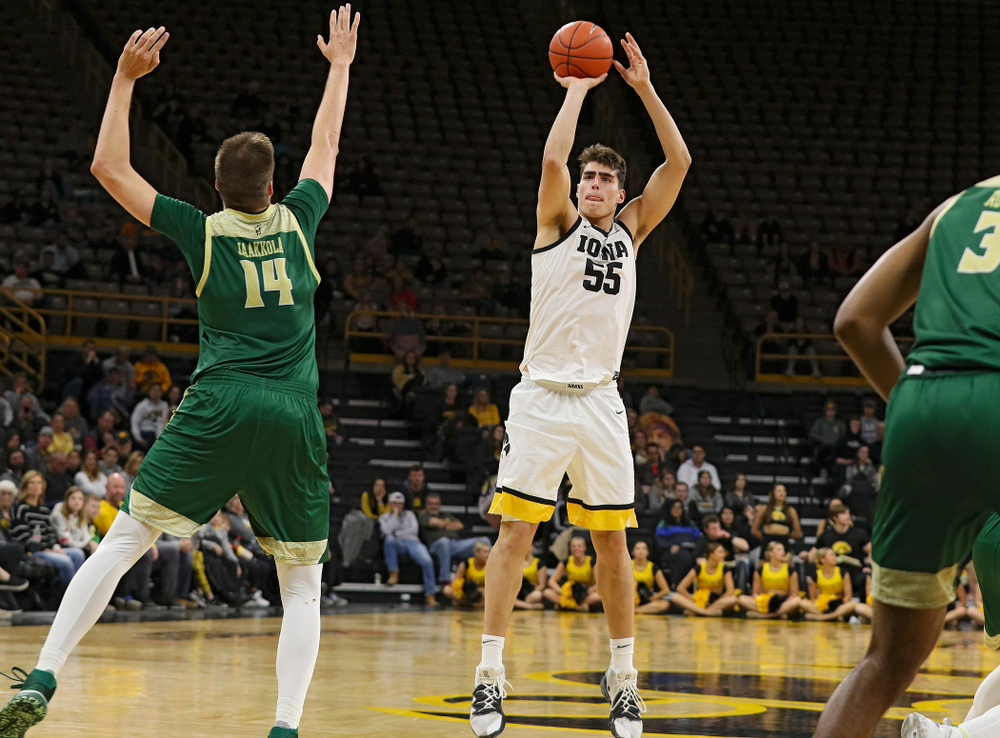 Iowa Hawkeyes center Luka Garza (55) makes a 3-pointer during the second half of their game at Carver-Hawkeye Arena in Iowa City on Sunday, Nov 24, 2019. (Stephen Mally/hawkeyesports.com)