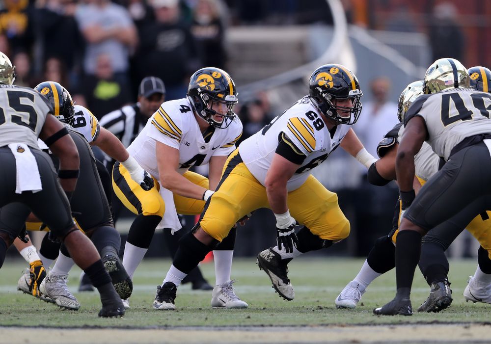 Iowa Hawkeyes offensive lineman Keegan Render (69) and quarterback Nate Stanley (4) against the Purdue Boilermakers Saturday, November 3, 2018 Ross Ade Stadium in West Lafayette, Ind. (Brian Ray/hawkeyesports.com)