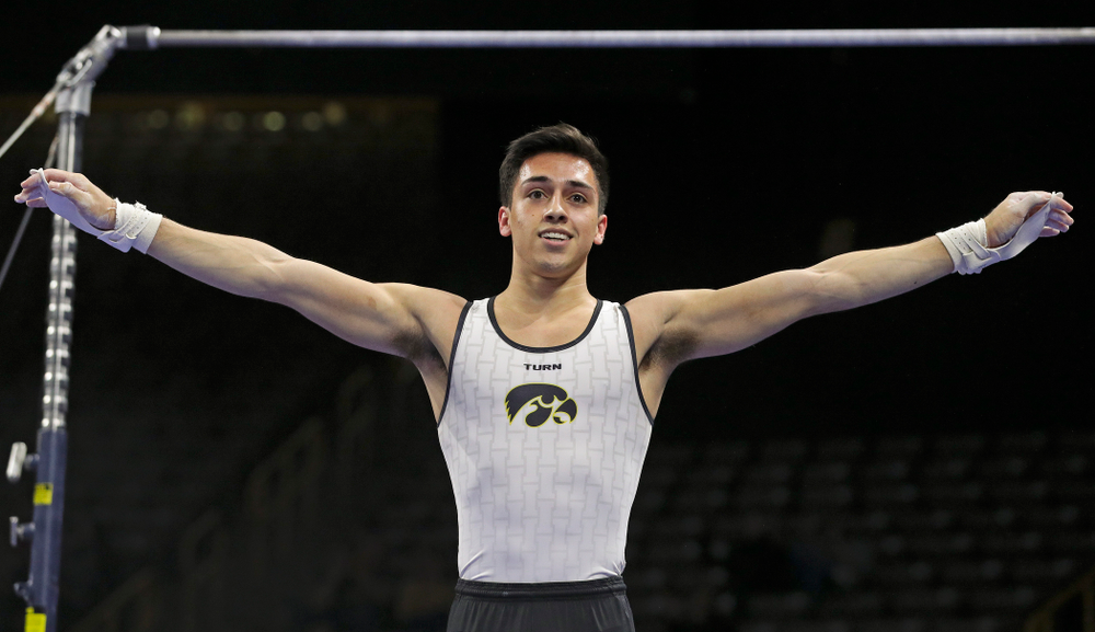 Iowa's Andrew Herrador competes in the parallel bars during the second day of the Big Ten Men's Gymnastics Championships at Carver-Hawkeye Arena in Iowa City on Saturday, Apr. 6, 2019. (Stephen Mally/hawkeyesports.com)