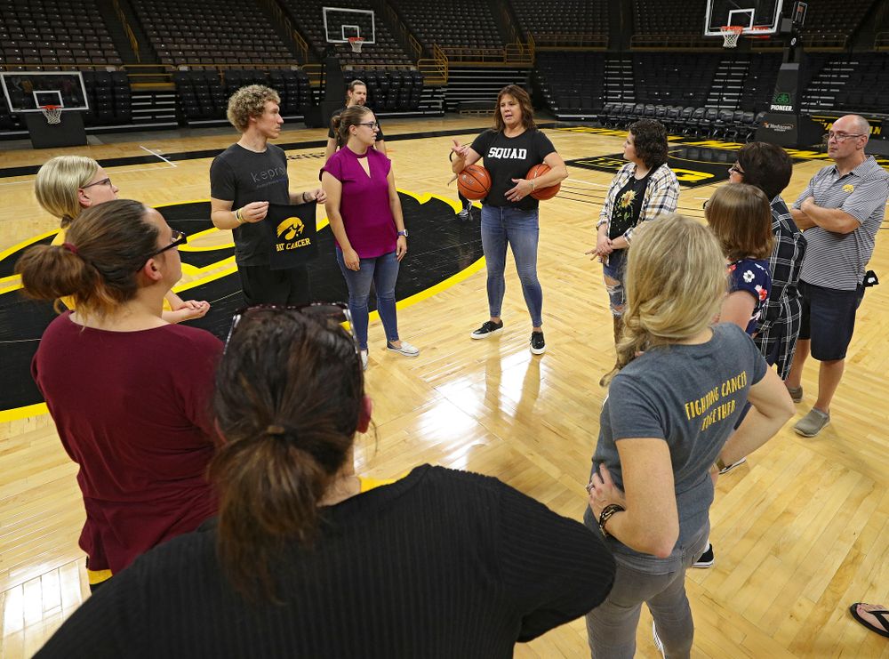 Margaret McCaffery talks with visitors from the University of Iowa Hospitals and Clinics Adolescent and Young Adult (AYA) Cancer Program at Carver-Hawkeye Arena in Iowa City on Monday, Sep 30, 2019. (Stephen Mally/hawkeyesports.com)