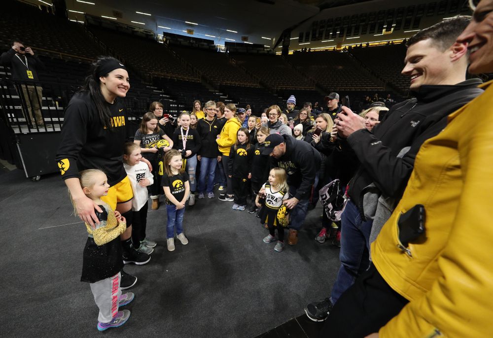 Iowa Hawkeyes forward Megan Gustafson (10) takes, photos, signs autographs, and gives hugs following senior day ceremonies Sunday, March 3, 2019 at Carver-Hawkeye Arena. (Brian Ray/hawkeyesports.com)