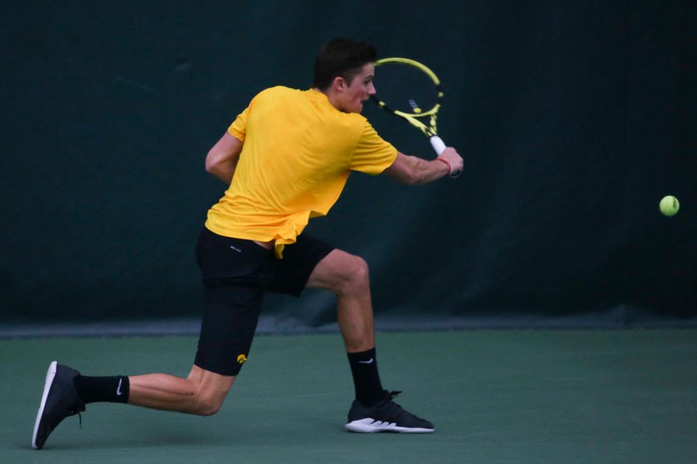 Iowa's Piotr Smietana at a tennis match vs Drake Friday, March 8, 2019 at the Hawkeye Tennis and Recreation Complex. (Lily Smith/hawkeyesports.com)