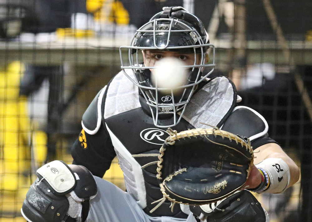 Iowa Hawkeyes catcher Brett McCleary (32) looks in a pitch during practice at the Hansen Football Performance Center in Iowa City on Friday, January 24, 2020. (Stephen Mally/hawkeyesports.com)