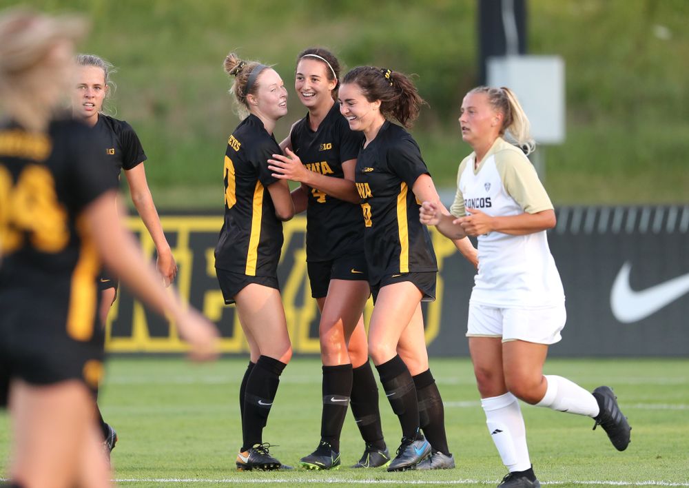 Iowa Hawkeyes forward Kaleigh Haus (4) and midfielder/defender Natalie Winters (10) celebrate a goal against Western Michigan Thursday, August 22, 2019 at the Iowa Soccer Complex. (Brian Ray/hawkeyesports.com)