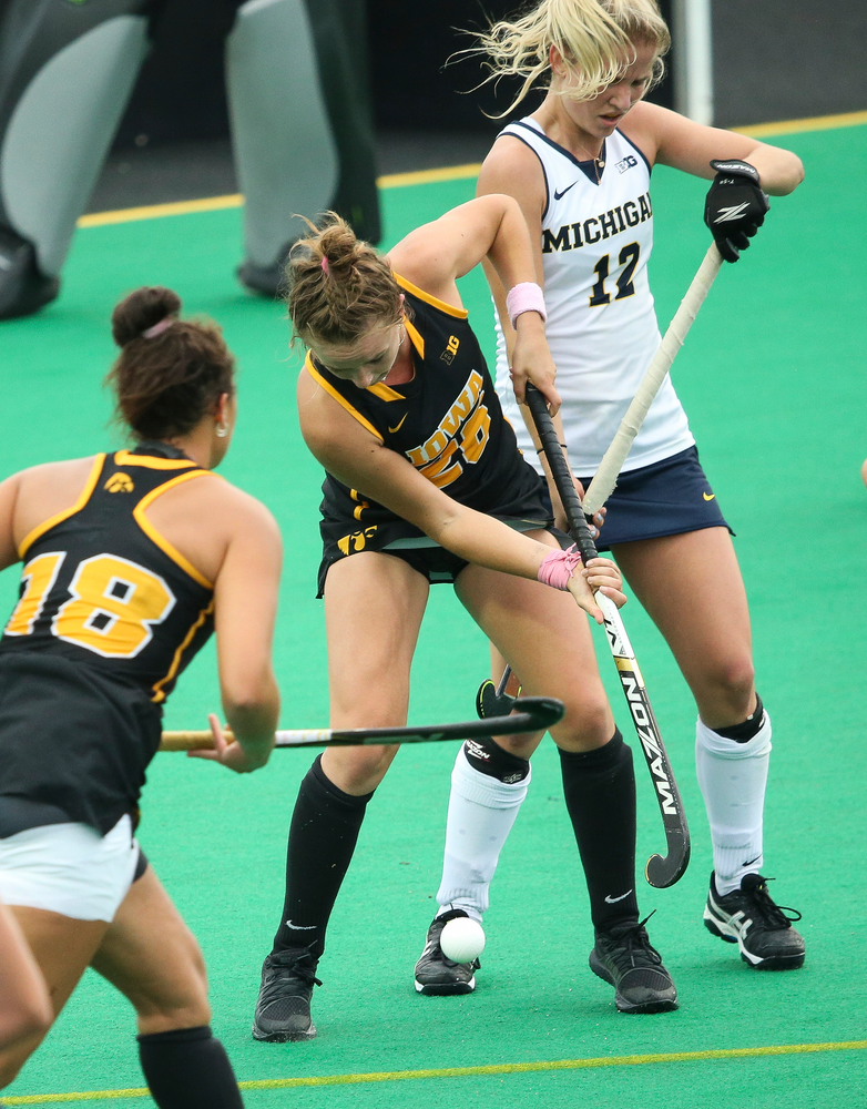 Iowa Hawkeyes forward Madeleine Murphy (26) fights for possession during a game against Michigan at Grant Field on October 5, 2018. (Tork Mason/hawkeyesports.com)