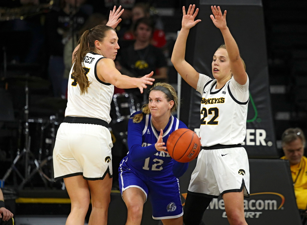 Iowa Hawkeyes forward Amanda Ollinger (43) and guard Kathleen Doyle (22) pressure Drake Bulldogs guard Brenni Rose (12) during the fourth quarter of their game at Carver-Hawkeye Arena in Iowa City on Saturday, December 21, 2019. (Stephen Mally/hawkeyesports.com)