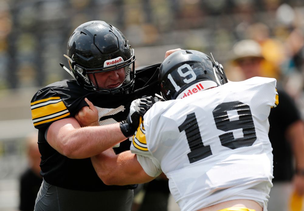 Iowa Hawkeyes offensive lineman Matt Fagan (54) and linebacker Mike Timm (19) during Kids Day Saturday, August 11, 2018 at Kinnick Stadium. (Brian Ray/hawkeyesports.com)