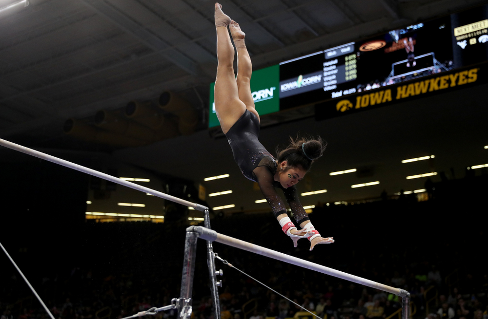 Iowa’s Clair Kaji competes on the bars against Michigan Friday, February 14, 2020 at Carver-Hawkeye Arena. (Brian Ray/hawkeyesports.com)