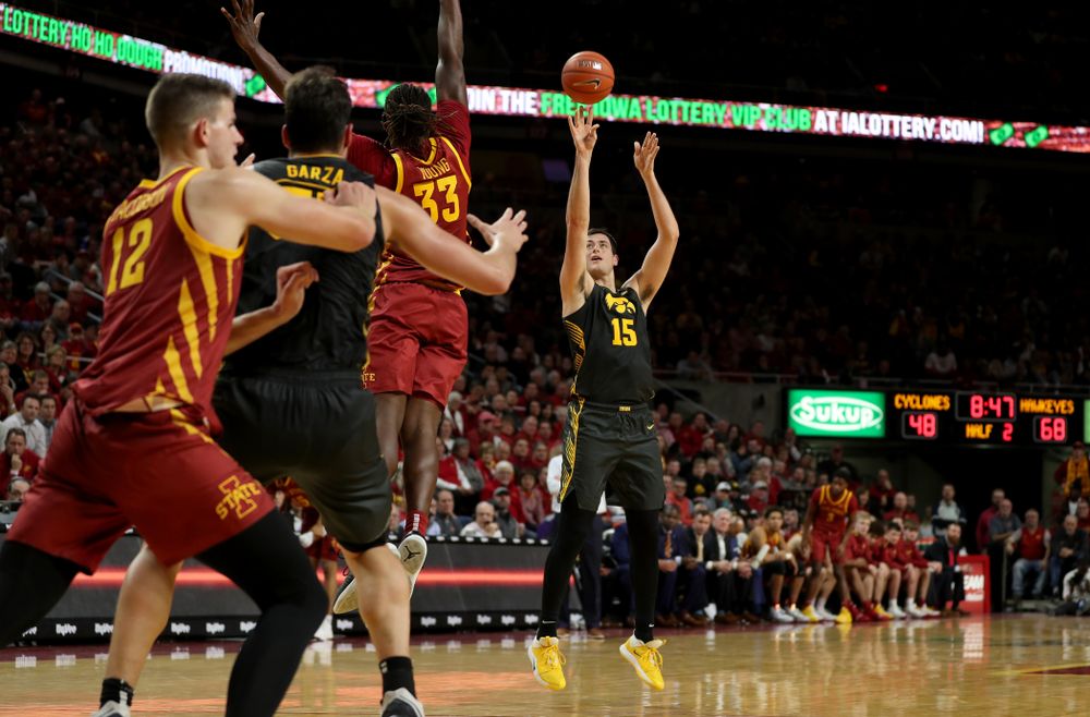Iowa Hawkeyes forward Ryan Kriener (15) knocks down a three point basket against the Iowa State Cyclones Thursday, December 12, 2019 at Hilton Coliseum in Ames, Iowa(Brian Ray/hawkeyesports.com)