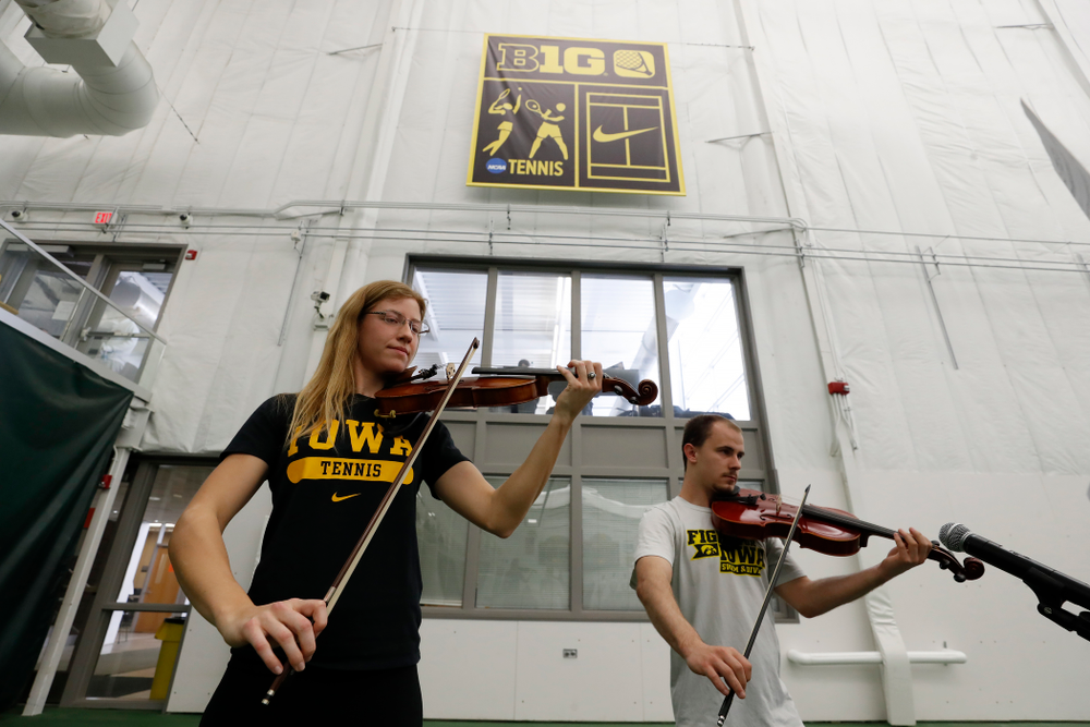 Iowa Diver Anton Hoherz and Women's Tennis Player Montana Crawford play the National Anthem before the Iowa Hawkeyes game against Purdue Sunday, April 15, 2018 at the Hawkeye Tennis and Recreation Center. (Brian Ray/hawkeyesports.com)