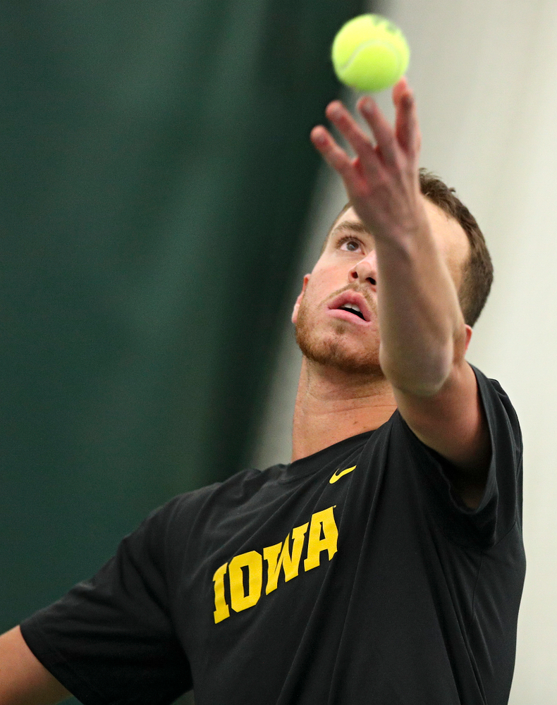 Iowa’s Kareem Allaf serves during their match at the Hawkeye Tennis and Recreation Complex in Iowa City on Thursday, January 16, 2020. (Stephen Mally/hawkeyesports.com)