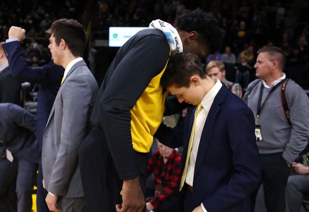 Iowa Hawkeyes forward Tyler Cook (25) prays with manager Dylan Mihalke before their game against the Nebraska Cornhuskers Sunday, January 6, 2019 at Carver-Hawkeye Arena. (Brian Ray/hawkeyesports.com)