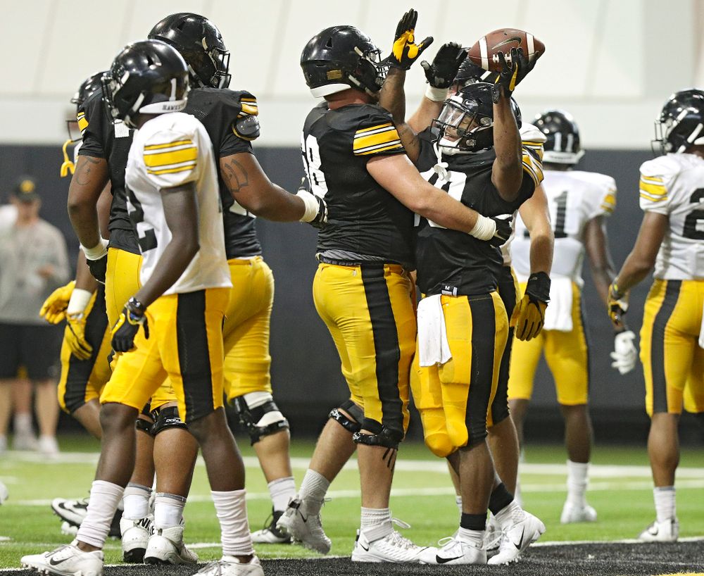 Iowa Hawkeyes running back Mekhi Sargent (10) celebrates with offensive lineman Landan Paulsen (68) in the end zone during Fall Camp Practice No. 6 at the Hansen Football Performance Center in Iowa City on Thursday, Aug 8, 2019. (Stephen Mally/hawkeyesports.com)