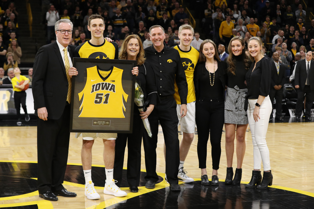 Iowa Hawkeyes forward Nicholas Baer (51) stands with head coach Fran McCaffery and his family during senior day actives before their game against the Rutgers Scarlet Knights Saturday, March 2, 2019 at Carver-Hawkeye Arena. (Brian Ray/hawkeyesports.com)
