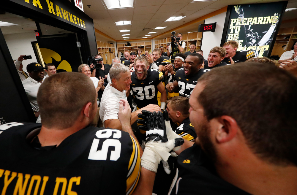 Iowa Hawkeyes head coach Kirk Ferentz celebrates his historic victory with his team following their game against the Northern Illinois Huskies Saturday, September 1, 2018 at Kinnick Stadium. (Brian Ray/hawkeyesports.com)