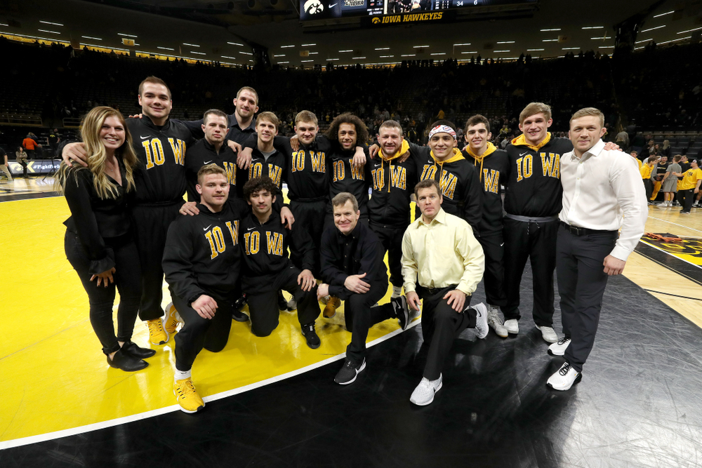 The Iowa Hawkeye seniors pose for a photo following their win over Oklahoma State on senior night Sunday, February 23, 2020 at Carver-Hawkeye Arena. (Brian Ray/hawkeyesports.com)