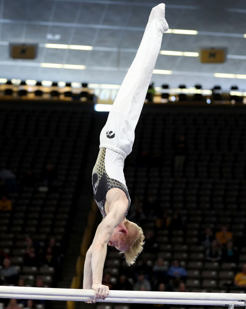 Iowa’s Nick Merryman competes on the parallel bars against UIC and Minnesota Saturday, February 1, 2020 at Carver-Hawkeye Arena. (Brian Ray/hawkeyesports.com)