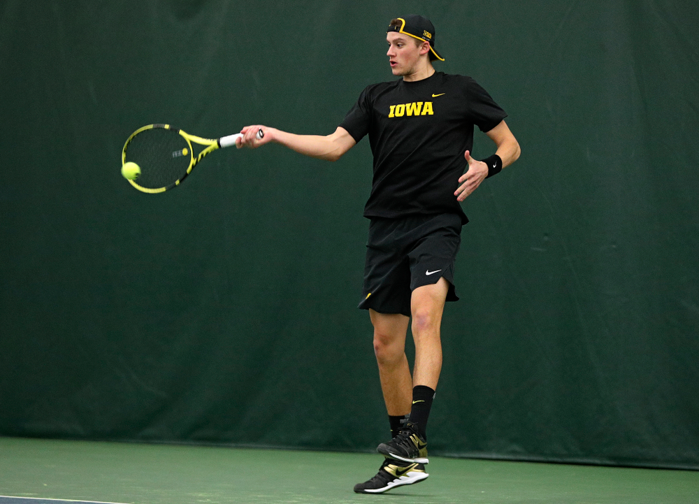 Iowa’s Joe Tyler returns a shot during his singles match at the Hawkeye Tennis and Recreation Complex in Iowa City on Friday, March 6, 2020. (Stephen Mally/hawkeyesports.com)