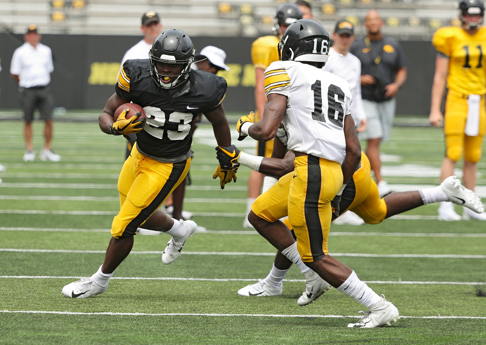 Iowa Hawkeyes running back Shadrick Byrd (23) tries to get around the end during Fall Camp Practice No. 8 at Kids Day at Kinnick Stadium in Iowa City on Saturday, Aug 10, 2019. (Stephen Mally/hawkeyesports.com)