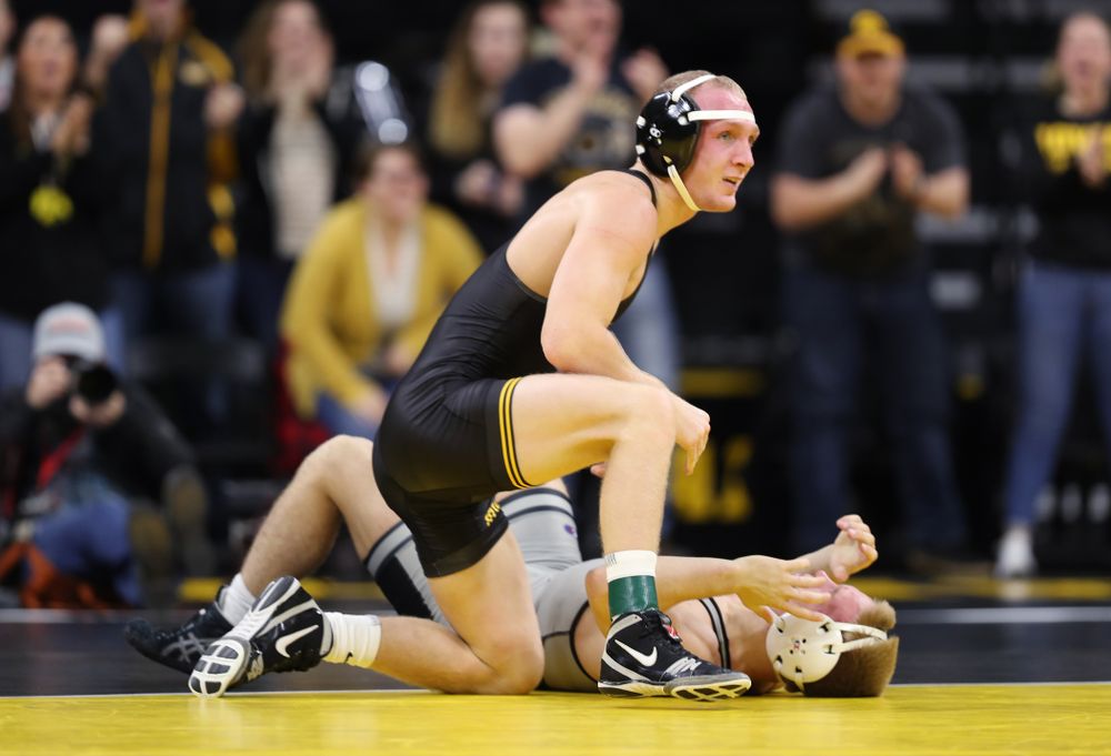 Iowa's Kaleb Young wrestles Purdue's Griffin Parriott at 157 pounds Saturday, November 24, 2018 at Carver-Hawkeye Arena. (Brian Ray/hawkeyesports.com)