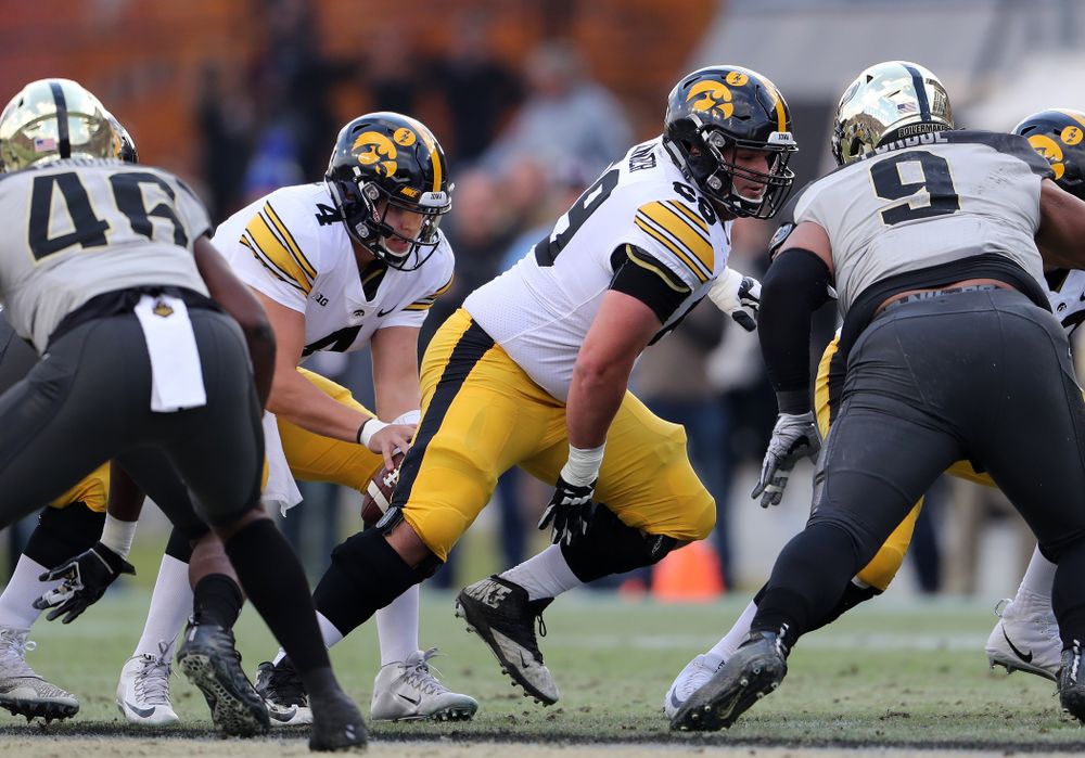 Iowa Hawkeyes offensive lineman Keegan Render (69) and quarterback Nate Stanley (4) against the Purdue Boilermakers Saturday, November 3, 2018 Ross Ade Stadium in West Lafayette, Ind. (Brian Ray/hawkeyesports.com)