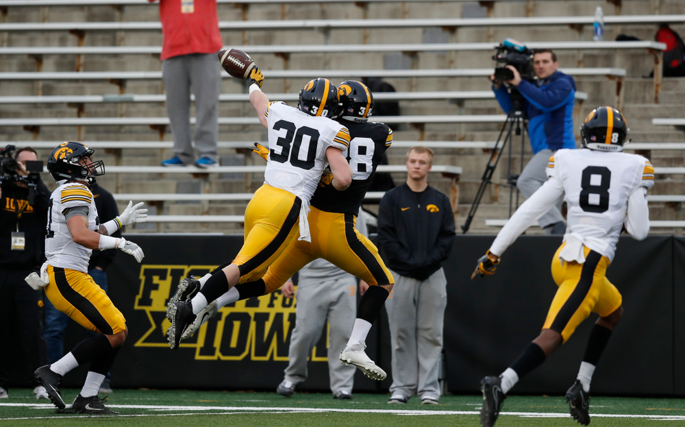 Iowa Hawkeyes defensive back Jake Gervase (30) and tight end T.J. Hockenson (38) during the final spring practice Friday, April 20, 2018 at Kinnick Stadium. (Brian Ray/hawkeyesports.com)