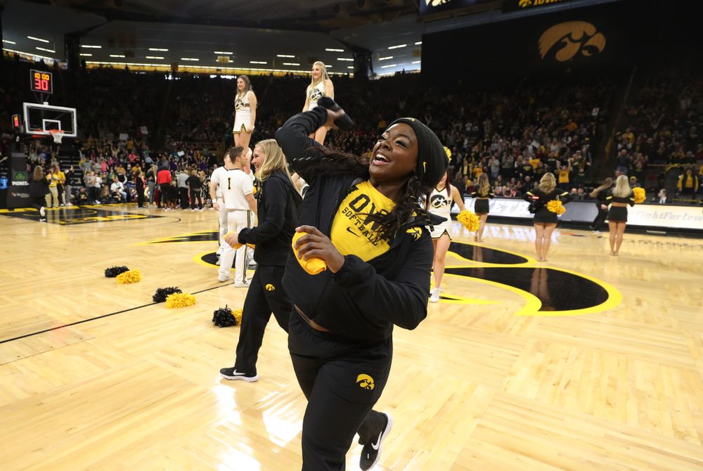 The Iowa Softball team throws out t-shirts during the Iowa Hawkeyes game against the Purdue Boilermakers Sunday, January 27, 2019 at Carver-Hawkeye Arena. (Brian Ray/hawkeyesports.com)