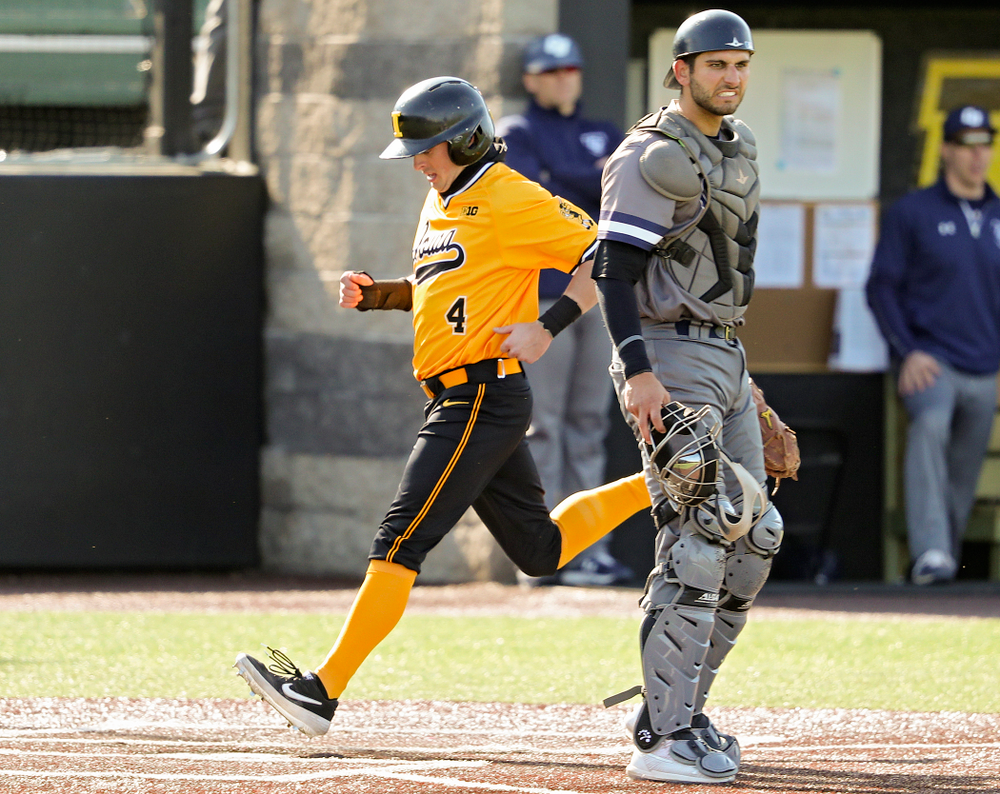 Iowa Hawkeyes second baseman Mitchell Boe (4) scores a run during the first inning of their game at Duane Banks Field in Iowa City on Tuesday, Apr. 2, 2019. (Stephen Mally/hawkeyesports.com)