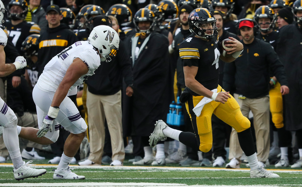 Iowa Hawkeyes quarterback Nate Stanley (4) runs the ball during a game against Northwestern at Kinnick Stadium on November 10, 2018. (Tork Mason/hawkeyesports.com)