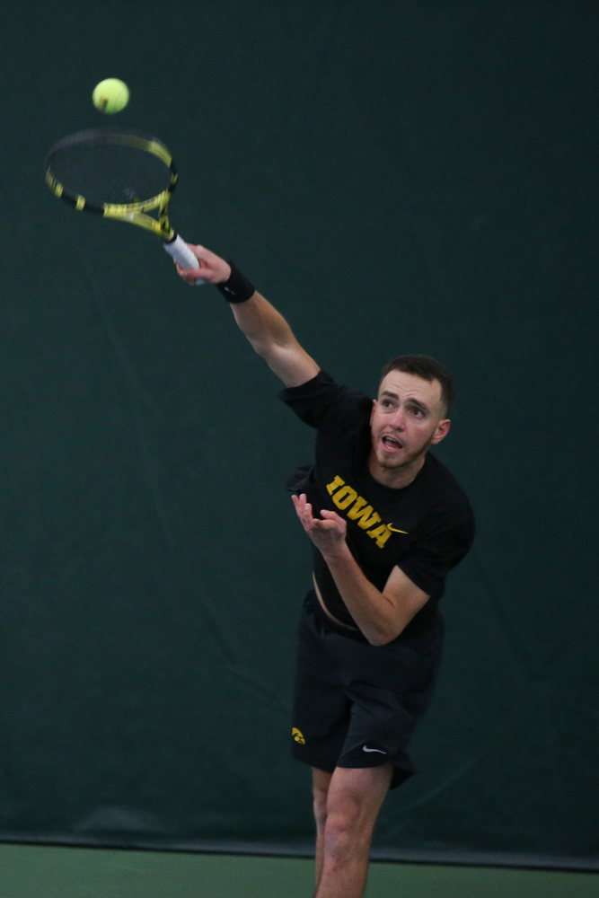 Iowa’s Kareem Allaf serves a ball during the Iowa men’s tennis meet vs VCU on Saturday, February 29, 2020 at the Hawkeye Tennis and Recreation Complex. (Lily Smith/hawkeyesports.com)