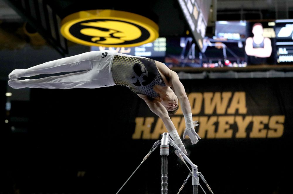 Iowa’s Mitch Mandozzi competes on the high bar against Illinois Sunday, March 1, 2020 at Carver-Hawkeye Arena. (Brian Ray/hawkeyesports.com)