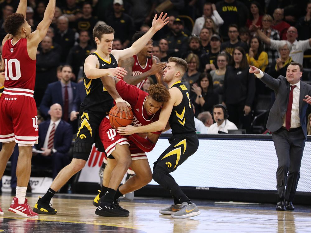 Iowa Hawkeyes guard Jordan Bohannon (3) and forward Nicholas Baer (51) against the Indiana Hoosiers Friday, February 22, 2019 at Carver-Hawkeye Arena. (Brian Ray/hawkeyesports.com)