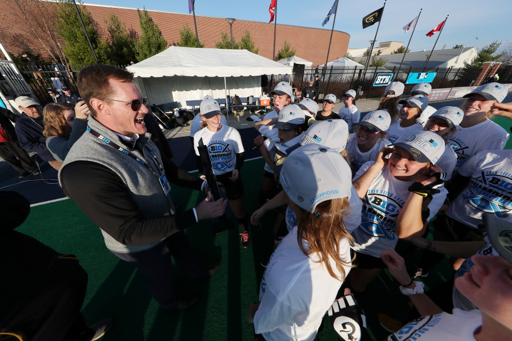Former Hawkeye Football Player AJ Edds presents the trophy to the Iowa Hawkeyes following their victory over Penn State in the 2019 Big Ten Field Hockey Tournament Championship Game Sunday, November 10, 2019 in State College. (Brian Ray/hawkeyesports.com)