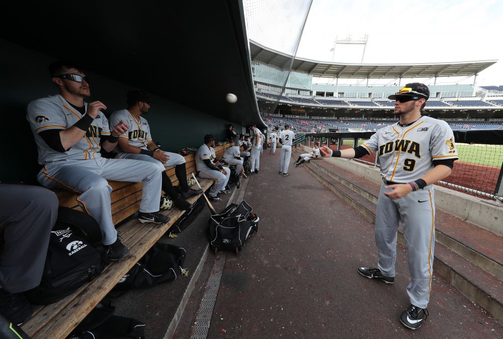 Iowa Hawkeyes outfielder Ben Norman (9) and Tanner Wetrich (16) wear special goggles that flicker to improve hand eye coordination as they play catch before their game against the Indiana Hoosiers in the first round of the Big Ten Baseball Tournament Wednesday, May 22, 2019 at TD Ameritrade Park in Omaha, Neb. (Brian Ray/hawkeyesports.com)