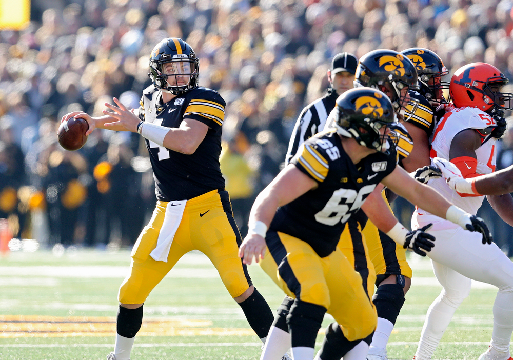 Iowa Hawkeyes quarterback Nate Stanley (4) looks to throw during the second quarter of their game at Kinnick Stadium in Iowa City on Saturday, Nov 23, 2019. (Stephen Mally/hawkeyesports.com)
