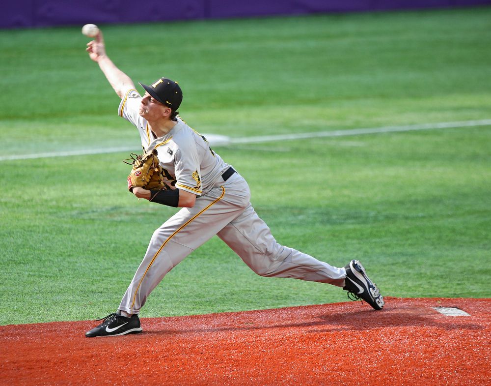Iowa Hawkeyes pitcher Drew Irvine (12) delivers to the plate during the seventh inning of their CambriaCollegeClassic game at U.S. Bank Stadium in Minneapolis, Minn. on Friday, February 28, 2020. (Stephen Mally/hawkeyesports.com)