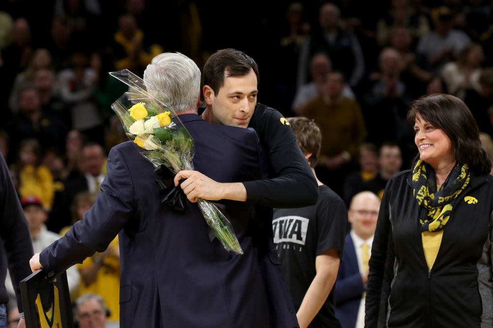 Iowa Hawkeyes forward Ryan Kriener (15) hold up his jersey during senior night activities before their game against the Purdue Boilermakers Tuesday, March 3, 2020 at Carver-Hawkeye Arena. (Brian Ray/hawkeyesports.com)